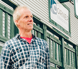 Mark Eaton posing in front of The Corner Coworking Inc.