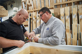 Stéphane Asselin, owner of Les Industries Mélymax, working with an employee