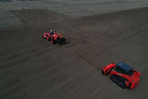 Strongfield Environmental Solutions - Tractors in a field, filmed by a drone