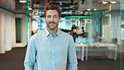 man standing in a high-tech office