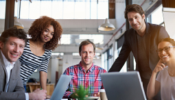 group of people smiling in a meeting