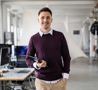 entrepreneur smiling, holding a tablet