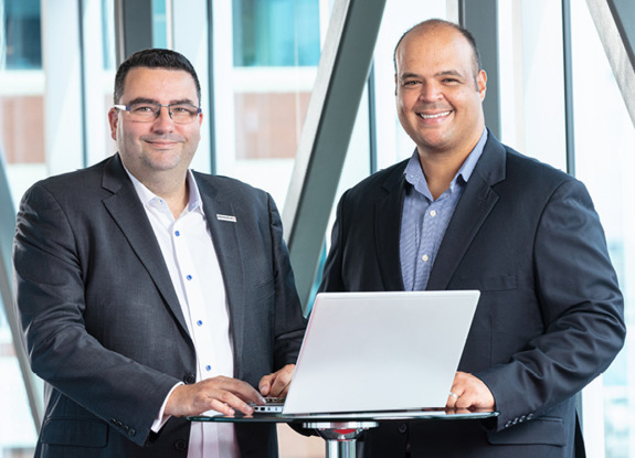 Mohamed Guetat - President and CEO of Momentum Technologies with an employee