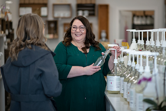 Fill-Vernon's Refill Store owner Teresa Sanders chatting with a customer