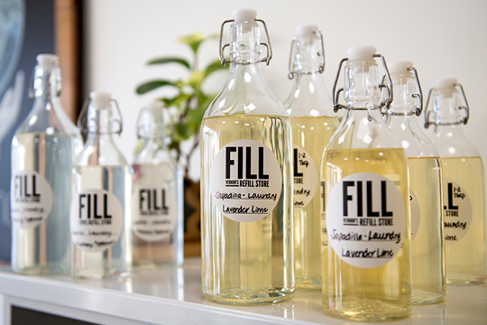 Glass containers refilled with hand sanitizer from FILL-Vernon's Refill Store