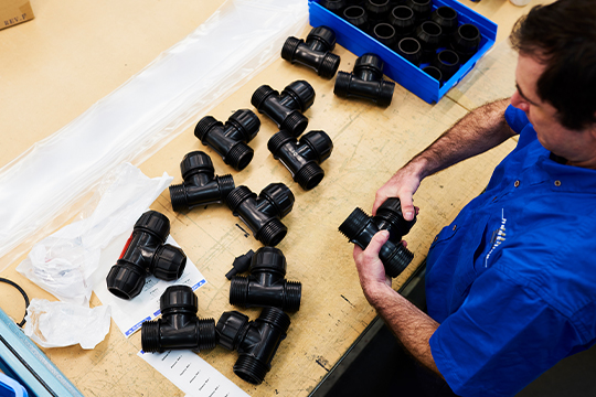 A Heat Line employee handling tools