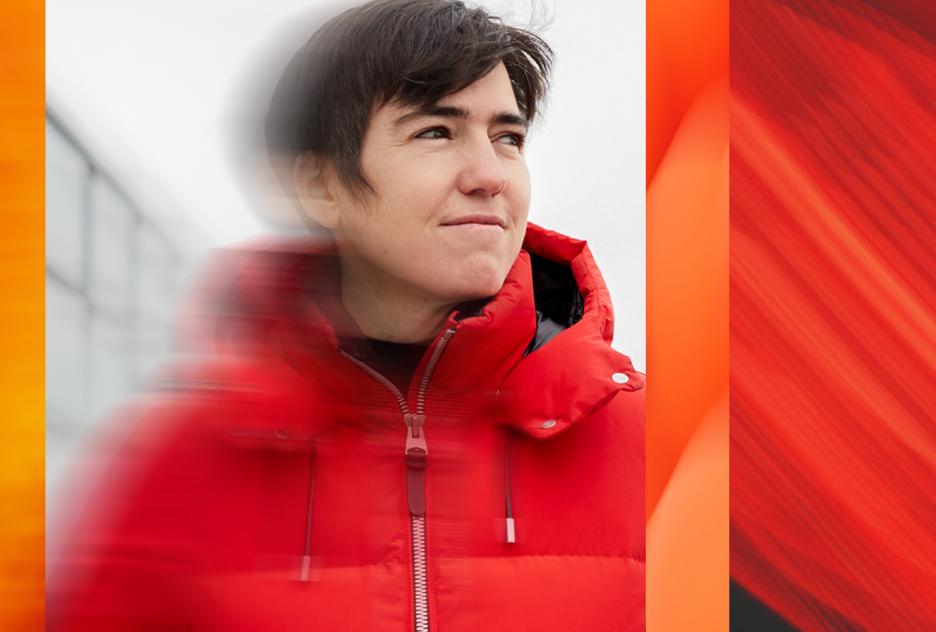 Waabi owner with a red coat looks to the right