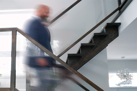 Andre Palaguine, CEO of the Nations Translation Group, going down a flight of stairs