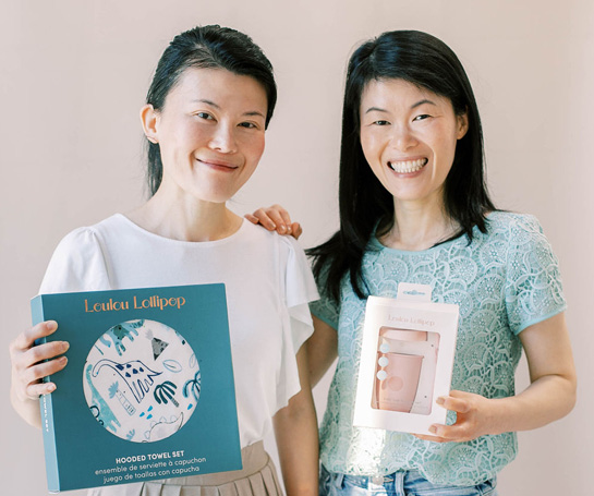 Eleanor Lee and Angel Kho, co-founders of Loulou Lollipop, holding their products