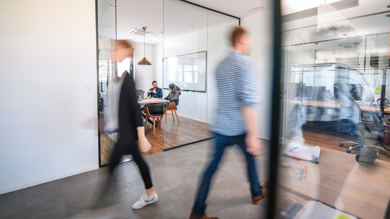 people walking in an office