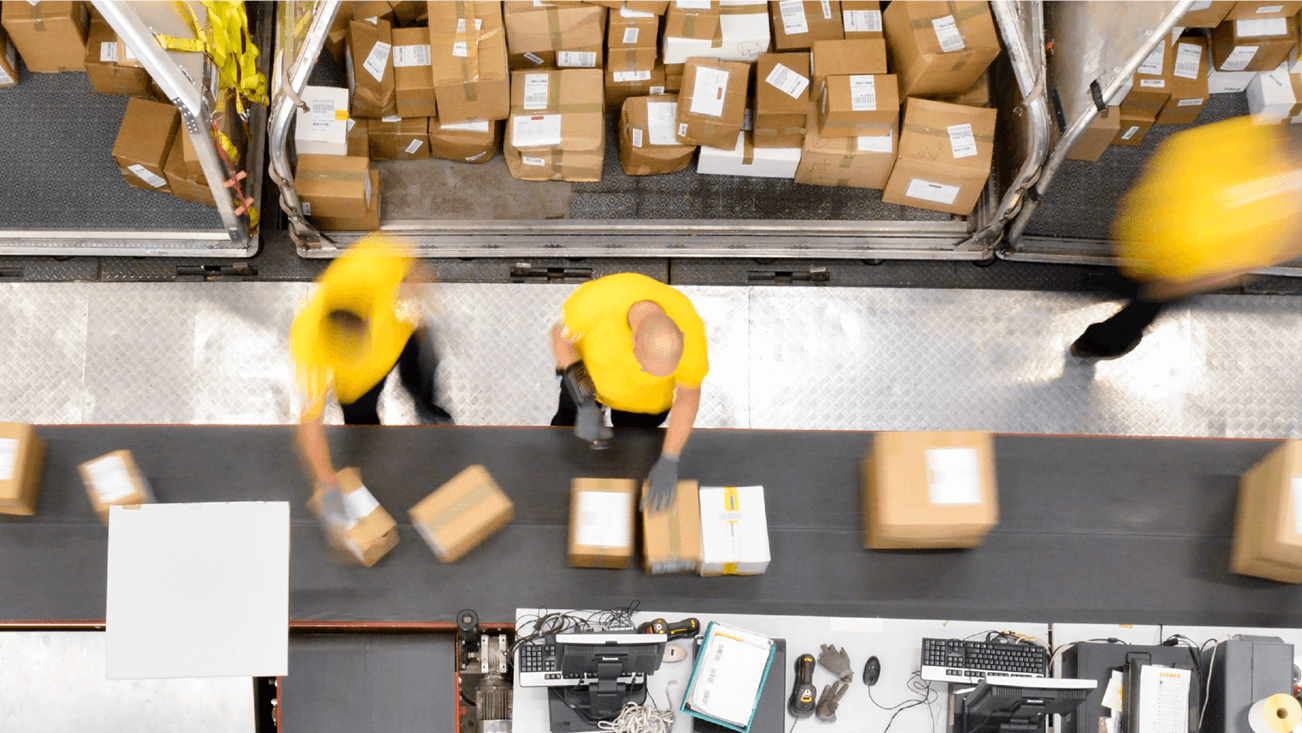 workers in yellow preparing shipment
