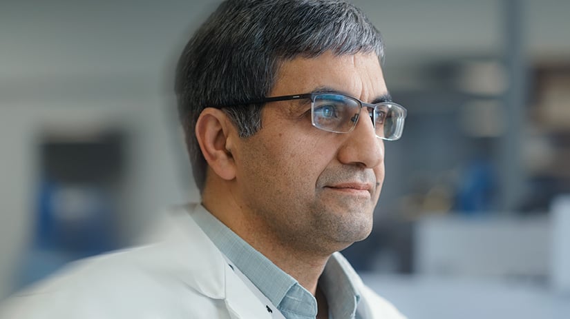 middle eastern mature pharmacist wearing glasses