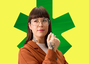Woman with eyeglasses and brown vest in front of a green and yellow bdc logo