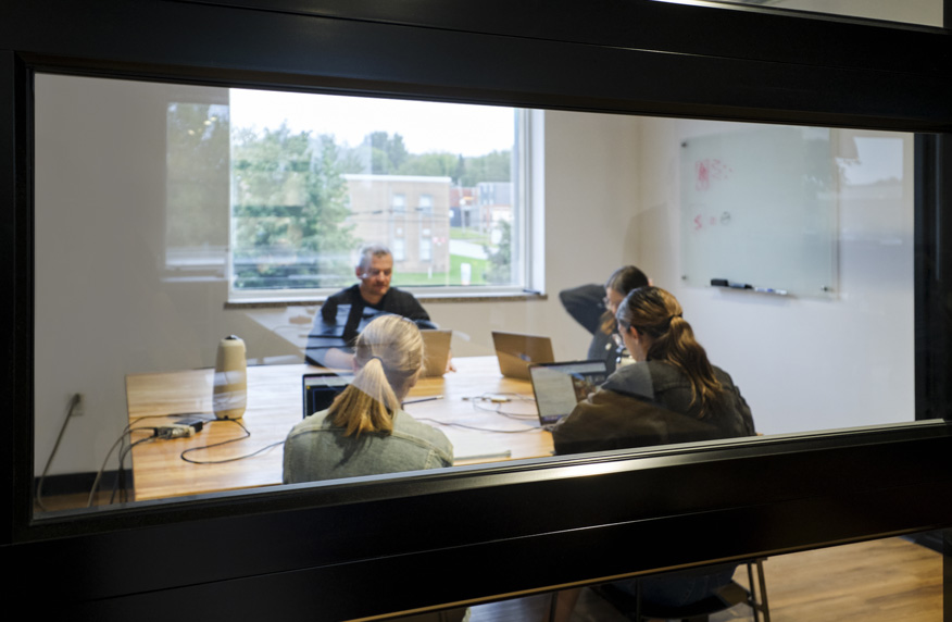 Axial Group employees in a meeting