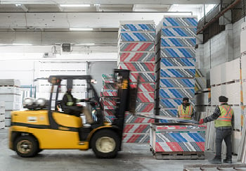 employees working in a building materials warehouse