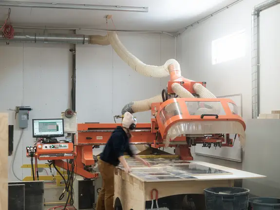 Cripps and Sons employees working in a woodworking warehouse