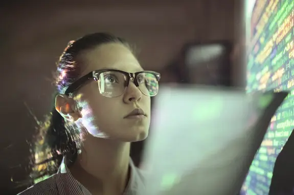 Woman looking at wall with code