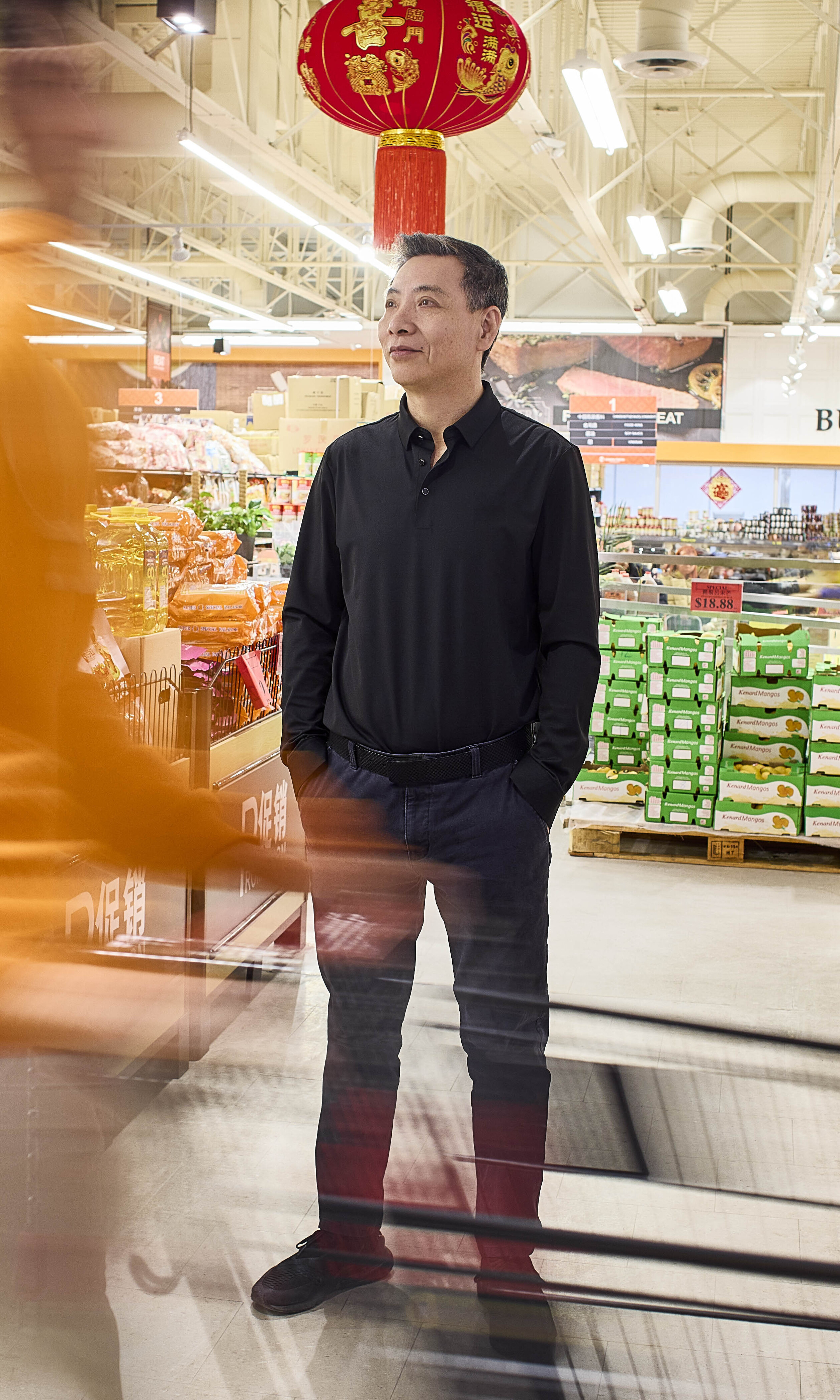 Faxing Tai standing in Green Fresh Supermarket