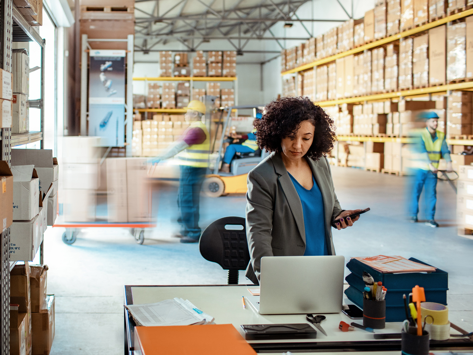 businesswoman working in delivery warehouse
