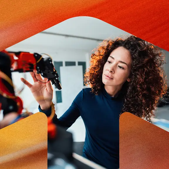 woman working with robotic arm